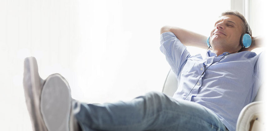 Man relaxing while listening audio